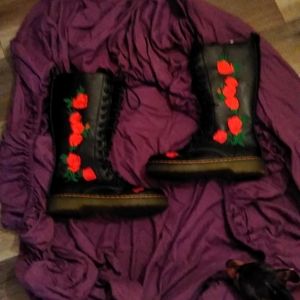 Beautiful pairs of calf-high black combat boots.